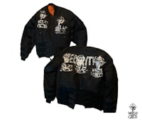 a black bomber jacket with a skull and crossbones on it