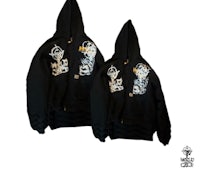 two black hoodies with embroidered designs on them